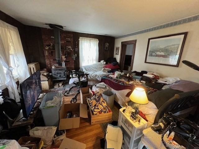 59 Eddy St, Springfield, MA 01104 - living area featuring wood finished floors and a wood stove