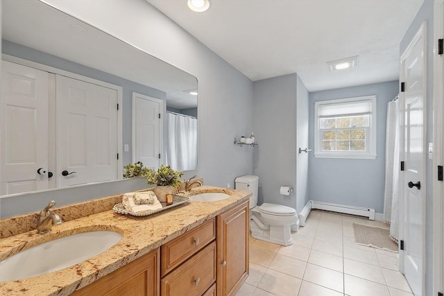 full bath with toilet, baseboards, a sink, and a baseboard radiator