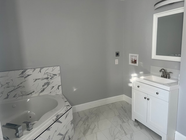 bathroom featuring vanity and a relaxing tiled tub