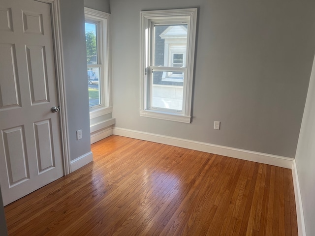 spare room featuring hardwood / wood-style flooring