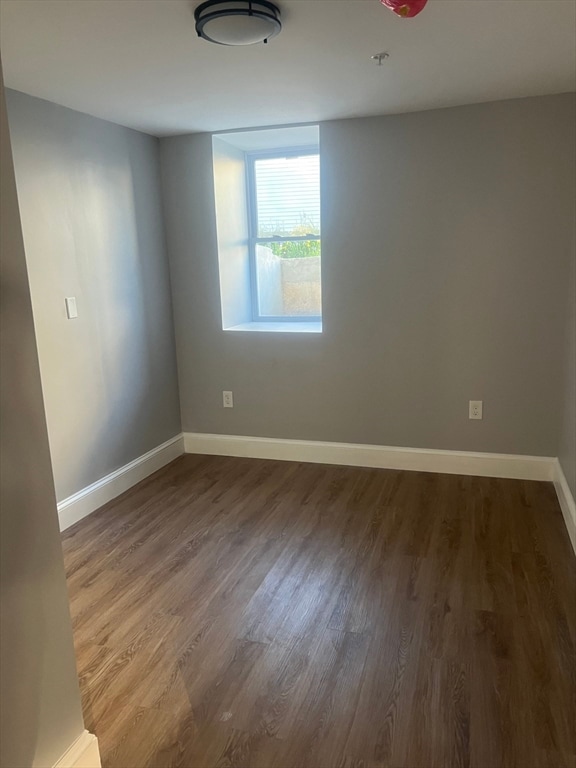 spare room featuring hardwood / wood-style flooring