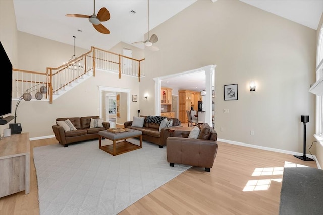 20 Ericka Cir, East Longmeadow, MA 01028 - living room with a ceiling fan, high vaulted ceiling, light wood-type flooring, stairs, and baseboards