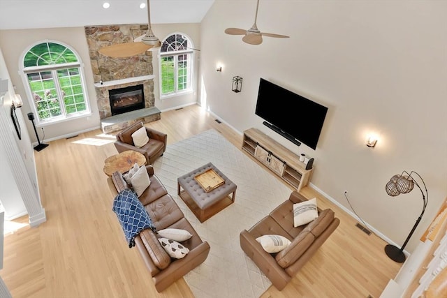 20 Ericka Cir, East Longmeadow, MA 01028 - living room with wood finished floors, a fireplace, a ceiling fan, baseboards, and lofted ceiling