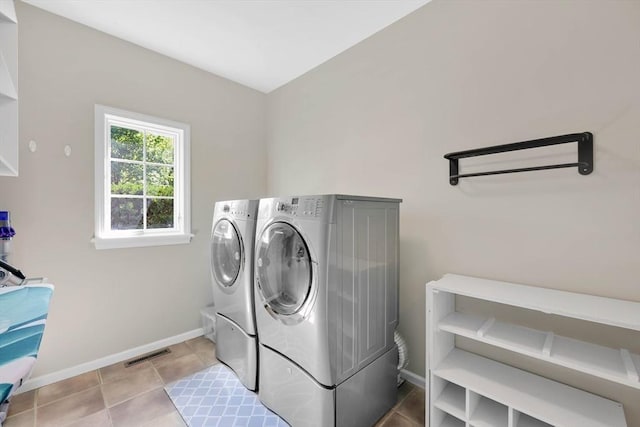 20 Ericka Cir, East Longmeadow, MA 01028 - laundry room featuring washing machine and dryer, baseboards, and tile patterned floors