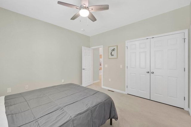 20 Ericka Cir, East Longmeadow, MA 01028 - bedroom with light colored carpet, a closet, baseboards, and a ceiling fan