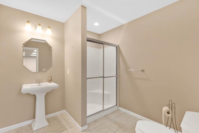 20 Ericka Cir, East Longmeadow, MA 01028 - bathroom featuring toilet, a shower stall, baseboards, tile patterned floors, and a sink