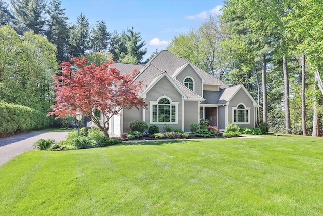 20 Ericka Cir, East Longmeadow, MA 01028 - view of front of property with a front yard, a shingled roof, and driveway