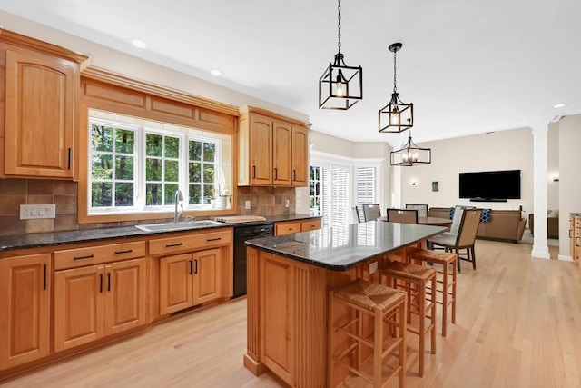 20 Ericka Cir, East Longmeadow, MA 01028 - kitchen with a sink, dishwasher, light wood-type flooring, decorative backsplash, and a kitchen island