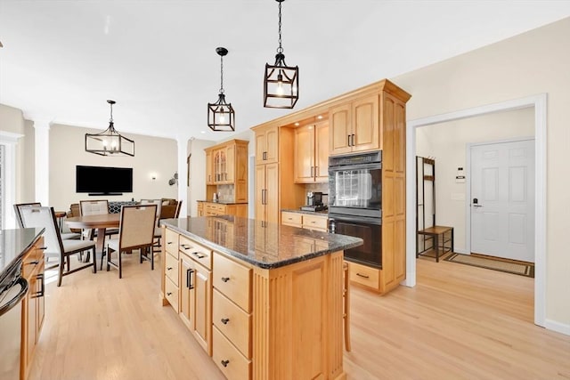 20 Ericka Cir, East Longmeadow, MA 01028 - kitchen with light brown cabinets, light wood-style flooring, a center island, dark stone countertops, and pendant lighting