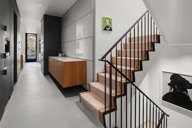 55 Fayerweather St, Cambridge, MA 02138 - stairway with bar and recessed lighting