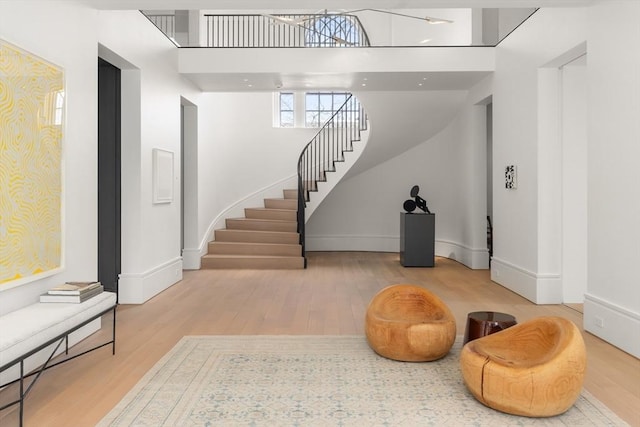 55 Fayerweather St, Cambridge, MA 02138 - entrance foyer with baseboards, wood finished floors, and stairs