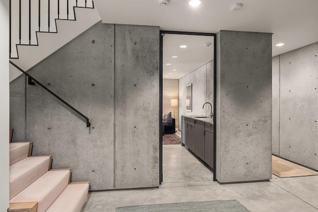 55 Fayerweather St, Cambridge, MA 02138 - staircase featuring recessed lighting and concrete flooring