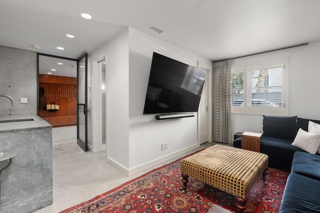55 Fayerweather St, Cambridge, MA 02138 - living area featuring recessed lighting, concrete floors, visible vents, and baseboards