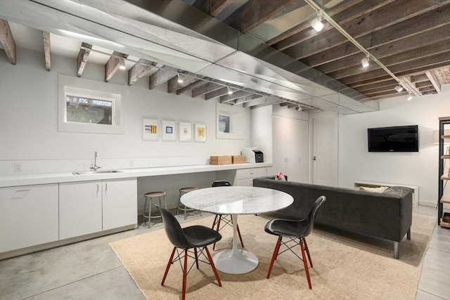 55 Fayerweather St, Cambridge, MA 02138 - dining area with finished concrete floors, beamed ceiling, and track lighting