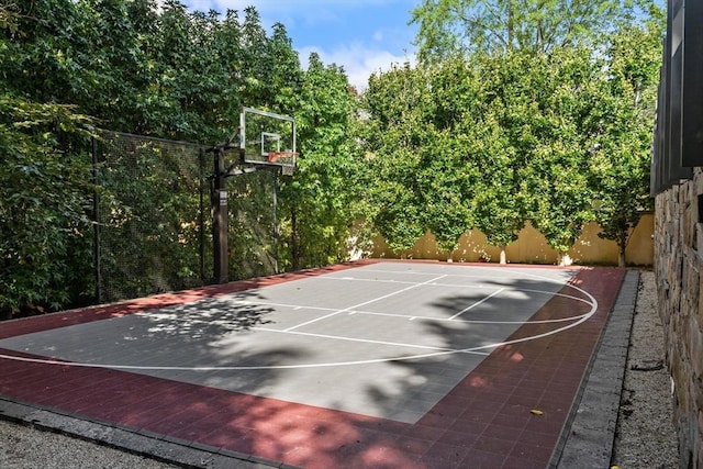 55 Fayerweather St, Cambridge, MA 02138 - view of sport court featuring basketball hoop and fence