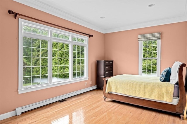 15 Henrys Ln, Norwell, MA 02061 - bedroom featuring a baseboard heating unit, multiple windows, crown molding, and wood finished floors