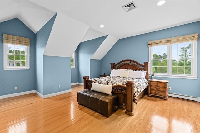 15 Henrys Ln, Norwell, MA 02061 - bedroom featuring baseboard heating, vaulted ceiling, multiple windows, wood finished floors, and recessed lighting
