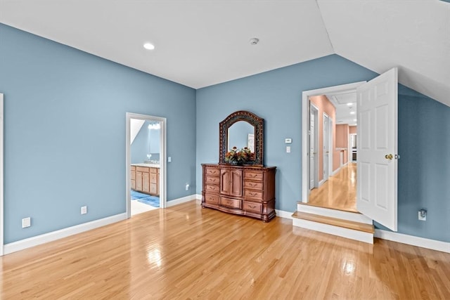 15 Henrys Ln, Norwell, MA 02061 - unfurnished bedroom with light wood finished floors, vaulted ceiling, baseboards, recessed lighting, and ensuite bathroom