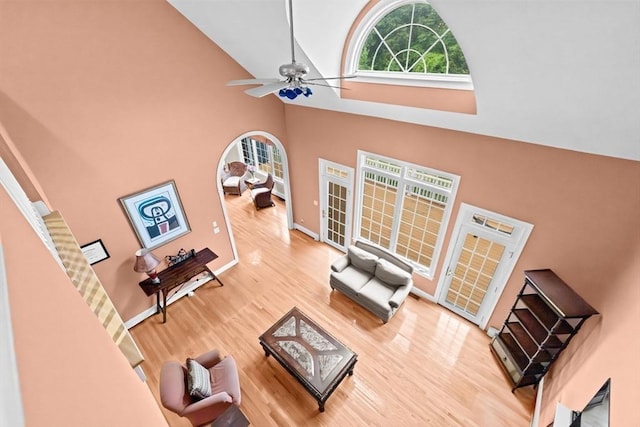 15 Henrys Ln, Norwell, MA 02061 - living area with high vaulted ceiling, wood finished floors, ceiling fan, and baseboards