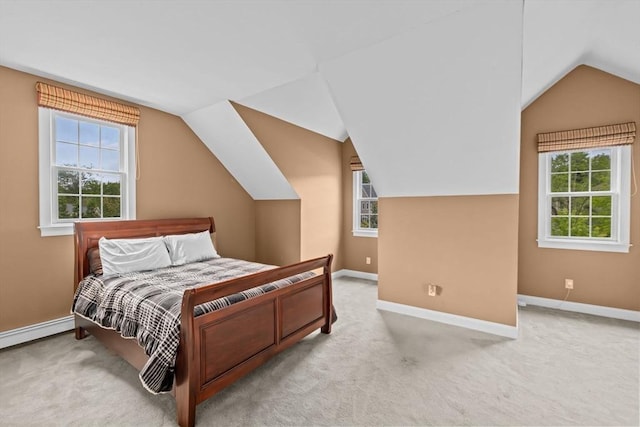 15 Henrys Ln, Norwell, MA 02061 - carpeted bedroom featuring vaulted ceiling, baseboards, multiple windows, and a baseboard heating unit