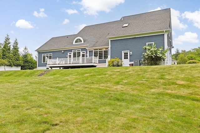 15 Henrys Ln, Norwell, MA 02061 - rear view of house with a wooden deck, a lawn, and a shingled roof