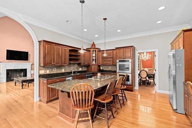 15 Henrys Ln, Norwell, MA 02061 - kitchen with appliances with stainless steel finishes, open shelves, tasteful backsplash, a sink, and light wood-style flooring