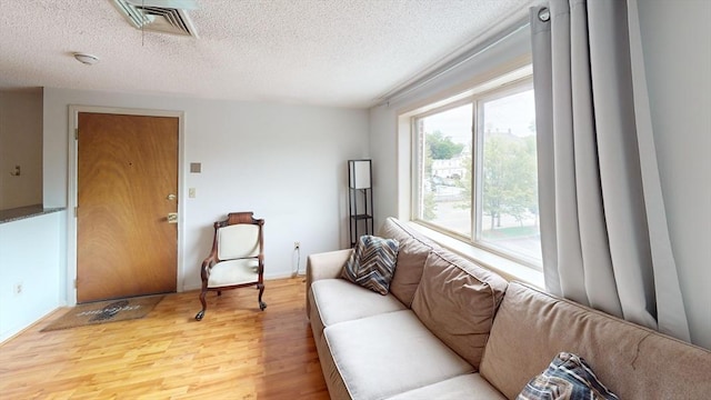 35 Prospect St Unit 309, Woburn, MA 01801 - living room with light wood-type flooring and a textured ceiling