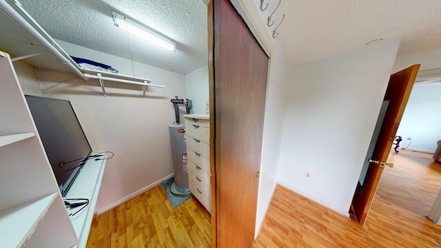 35 Prospect St Unit 309, Woburn, MA 01801 - spacious closet with electric water heater and light wood-style flooring