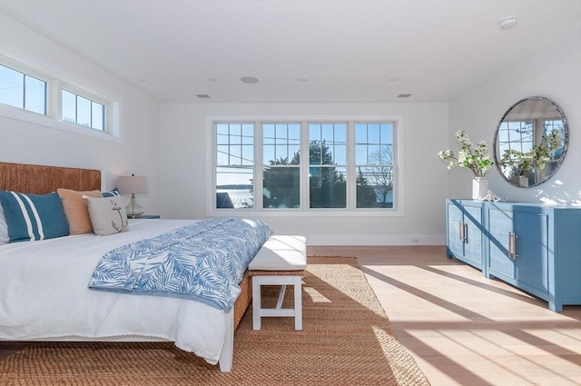 25 W Ave, Marion, MA 02738 - bedroom with visible vents, baseboards, and light wood-type flooring