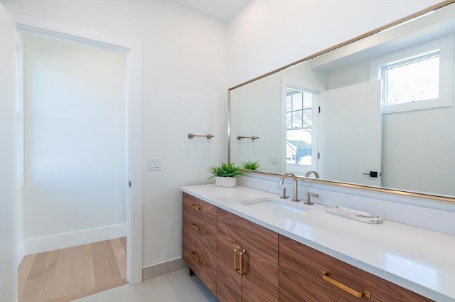 25 W Ave, Marion, MA 02738 - bathroom with a healthy amount of sunlight, vanity, and baseboards