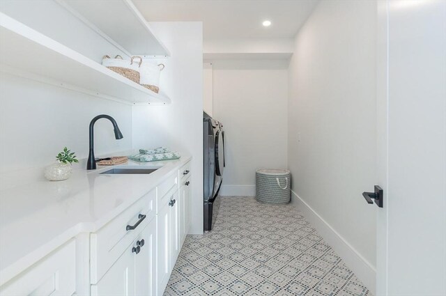 25 W Ave, Marion, MA 02738 - laundry area with independent washer and dryer, cabinet space, a sink, recessed lighting, and baseboards