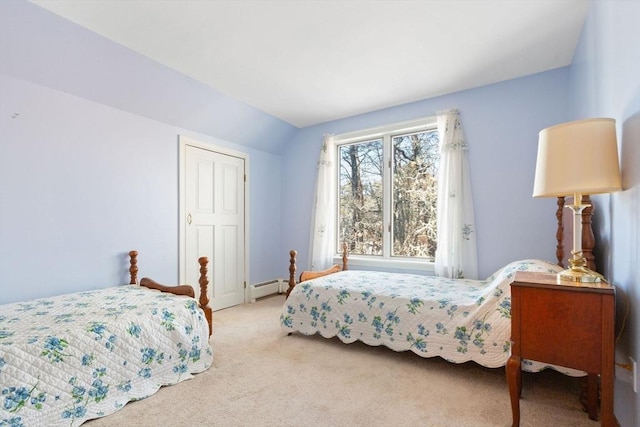 bedroom with lofted ceiling, a baseboard heating unit, and light carpet