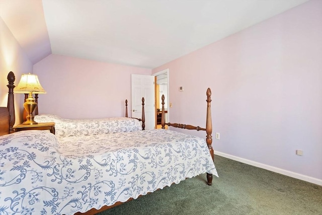 bedroom featuring vaulted ceiling and carpet floors