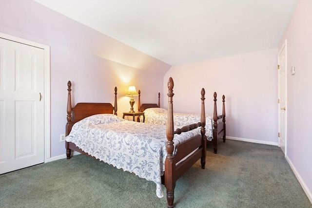 bedroom featuring lofted ceiling and carpet