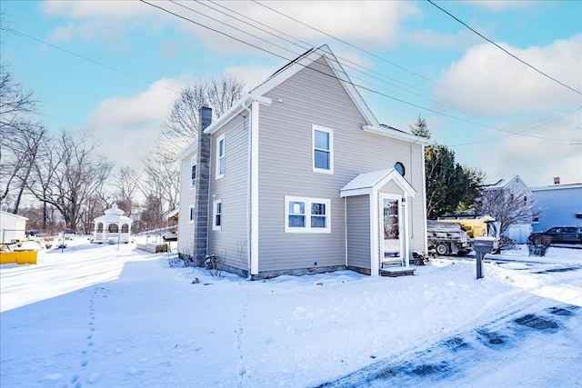 view of snow covered property