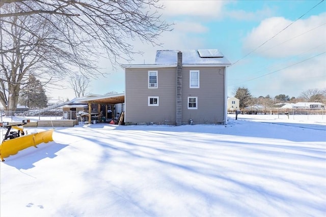 view of snow covered house