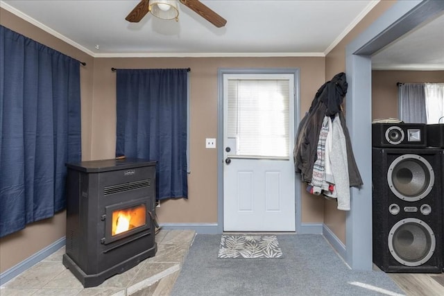 interior space with crown molding, stacked washer and dryer, a healthy amount of sunlight, and a wood stove