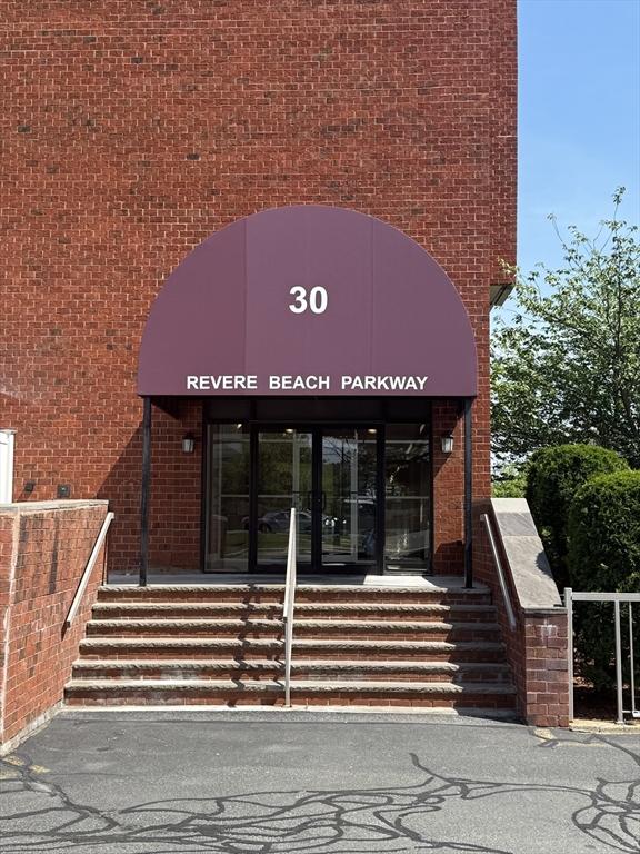 30 Revere Beach Pkwy Unit 116, Medford, MA 02155 - property entrance featuring brick siding
