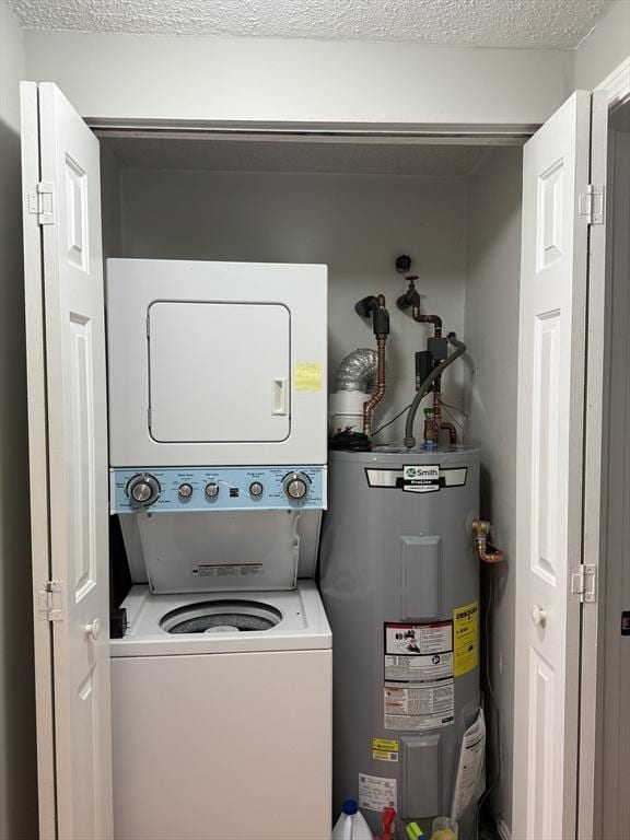 30 Revere Beach Pkwy Unit 116, Medford, MA 02155 - clothes washing area featuring water heater and stacked washer / dryer