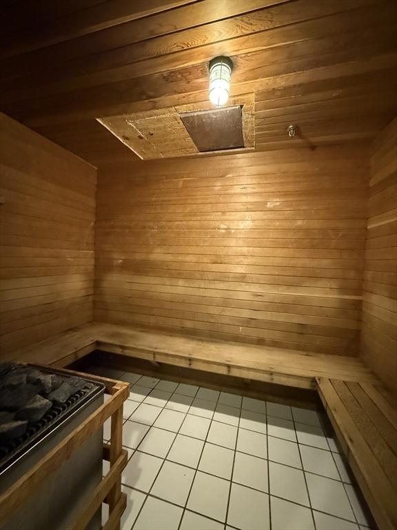 30 Revere Beach Pkwy Unit 116, Medford, MA 02155 - sauna featuring wood ceiling, tile patterned floors, and wood walls