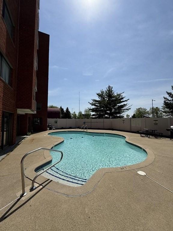 30 Revere Beach Pkwy Unit 116, Medford, MA 02155 - community pool featuring fence and a patio