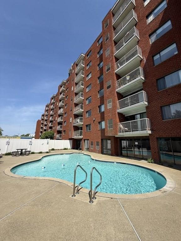 30 Revere Beach Pkwy Unit 116, Medford, MA 02155 - community pool featuring fence and a patio