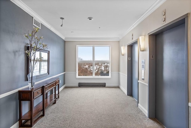 hallway with crown molding, carpet, and elevator