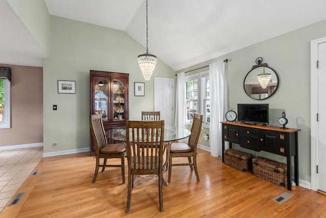 97 Connecticut Ave, Springfield, MA 01104 - dining area with a chandelier, light wood-style flooring, and high vaulted ceiling