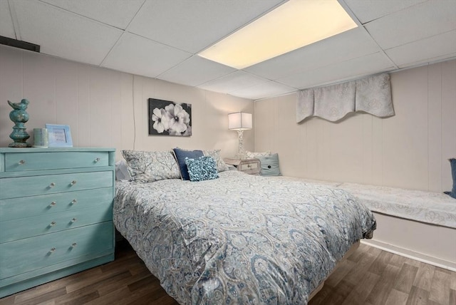 97 Connecticut Ave, Springfield, MA 01104 - bedroom featuring a drop ceiling, wood finished floors, and a decorative wall