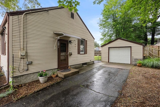 97 Connecticut Ave, Springfield, MA 01104 - view of front of home with asphalt driveway, an outdoor structure, and a detached garage