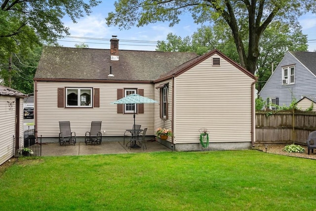 97 Connecticut Ave, Springfield, MA 01104 - rear view of house with a chimney, a patio, and a shingled roof