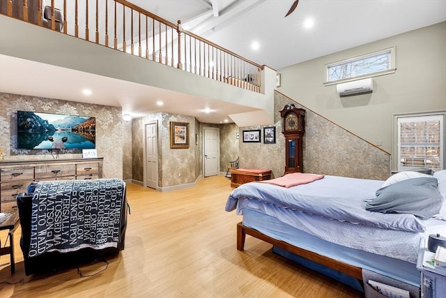 285 Still River Rd, Bolton, MA 01740 - bedroom with recessed lighting, wood finished floors, a wall mounted AC, baseboards, and a high ceiling
