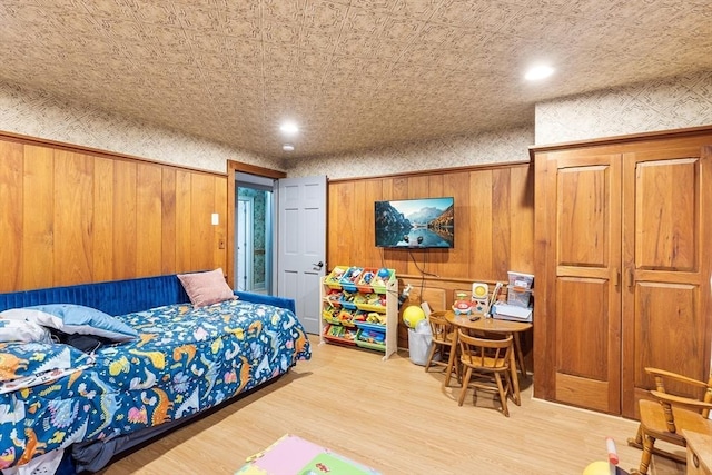 285 Still River Rd, Bolton, MA 01740 - bedroom featuring wood walls, wood finished floors, and recessed lighting
