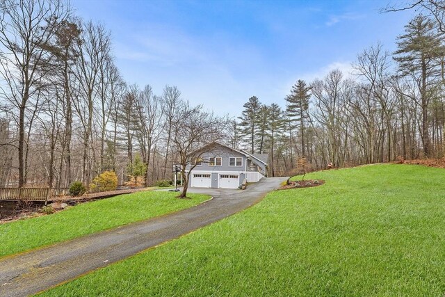 285 Still River Rd, Bolton, MA 01740 - view of front of house with driveway, a front lawn, and a garage